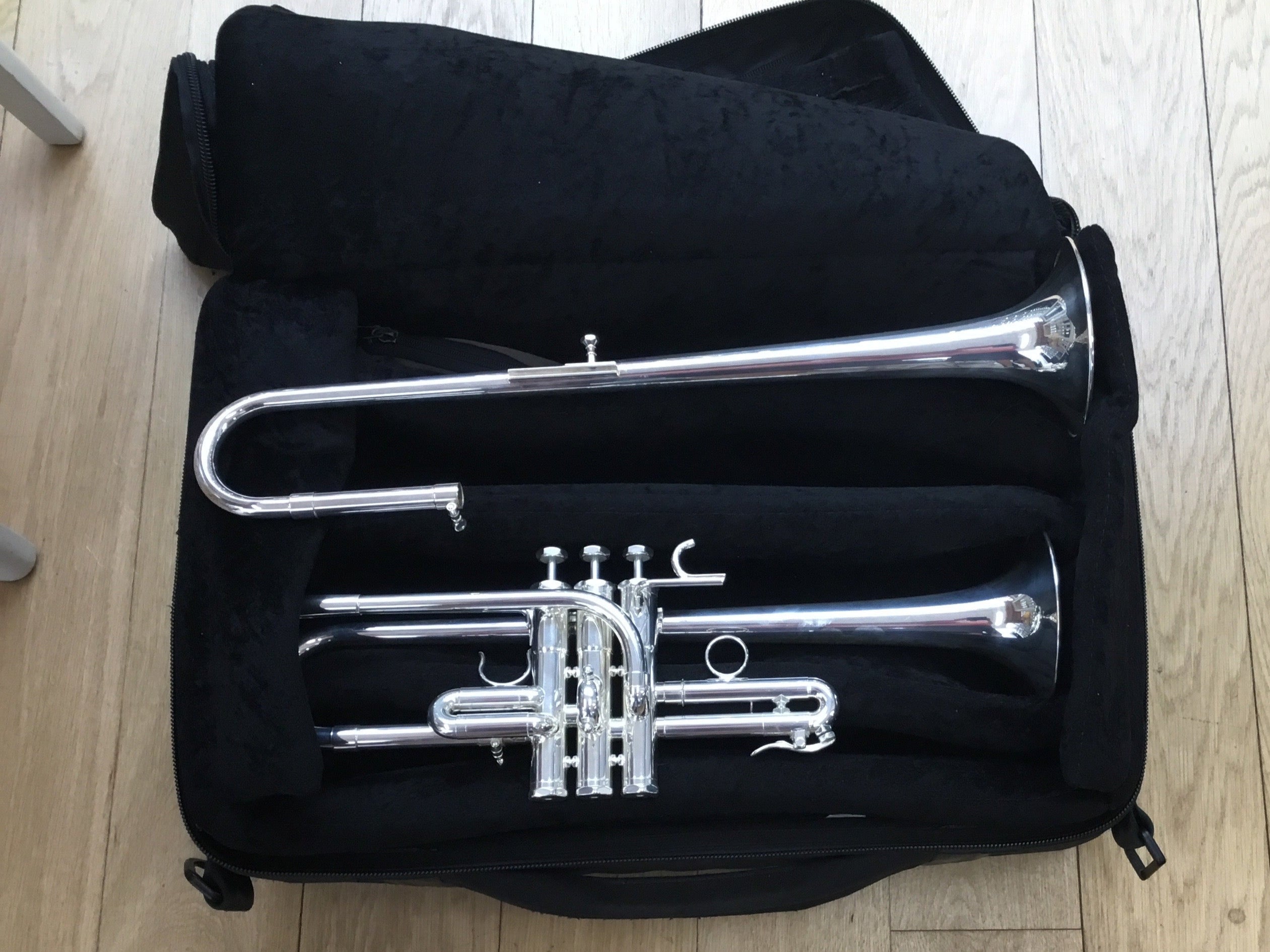 Schilke E3L Eb/D trumpet in triple gig bag